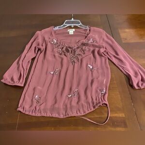 Lucky Brand ladies blouse is a size Small.